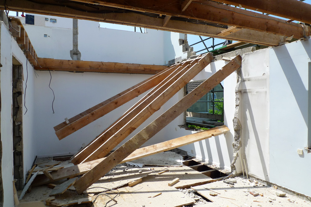 Demolition - Upper floor joists being removed