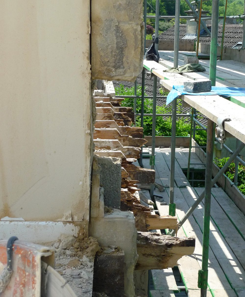 Demolition - Rotten ends of upper floor joists where they penerated the exterior wall to support the balcony