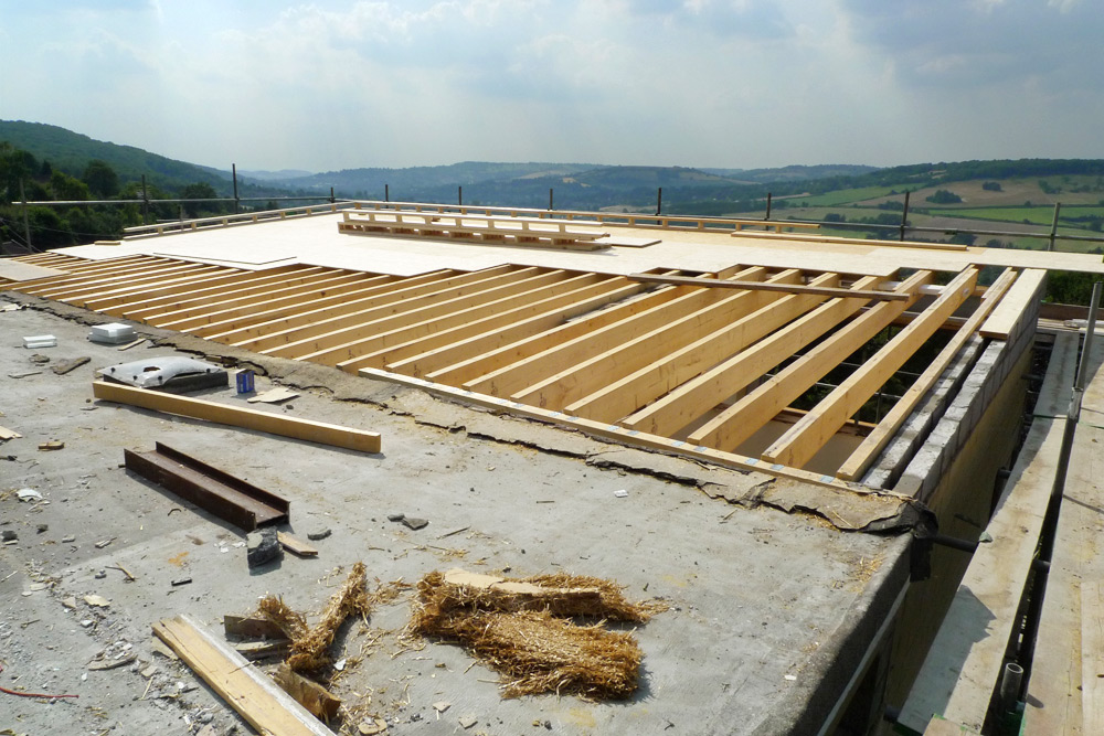 Rebuild - OSB 3 SmartPly roof deck being laid