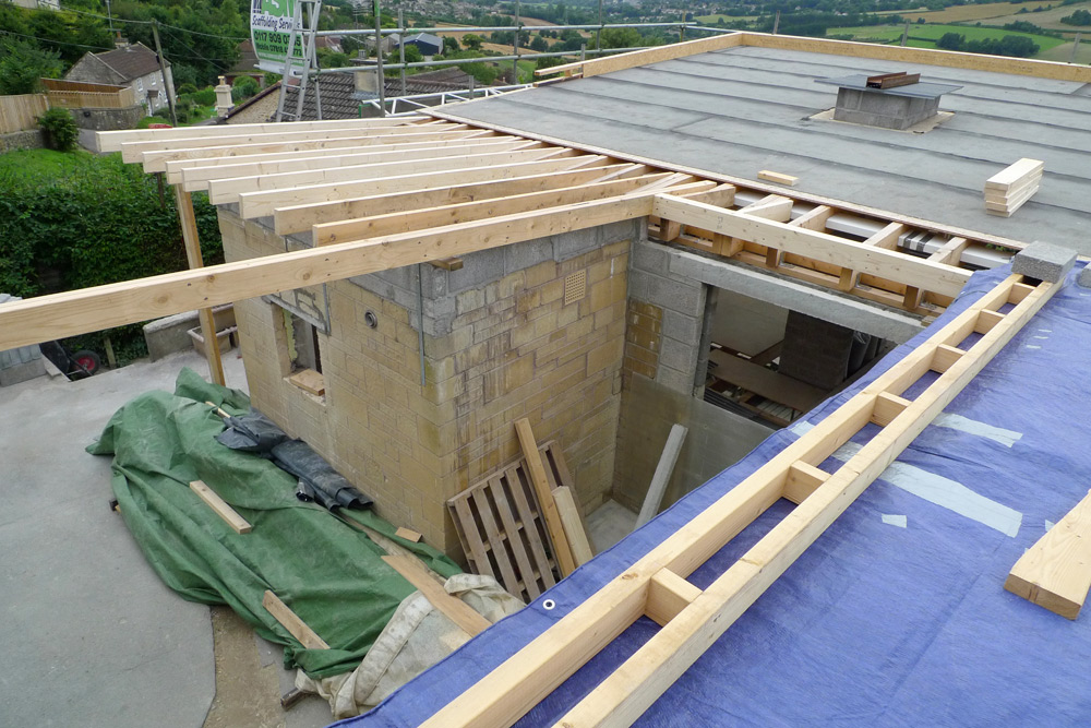 Rebuild - Roof joists being installed on back portion of building