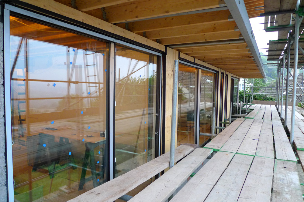 Rebuild - Lower floor glazing, balcony joists, timber infills & airtightness taping