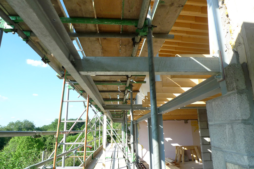 Steelwork - Balcony torsional restraints and supports cantilevered from the steel frame